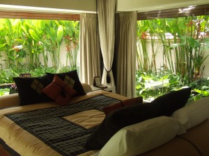 bedroom with surrounding interior pool